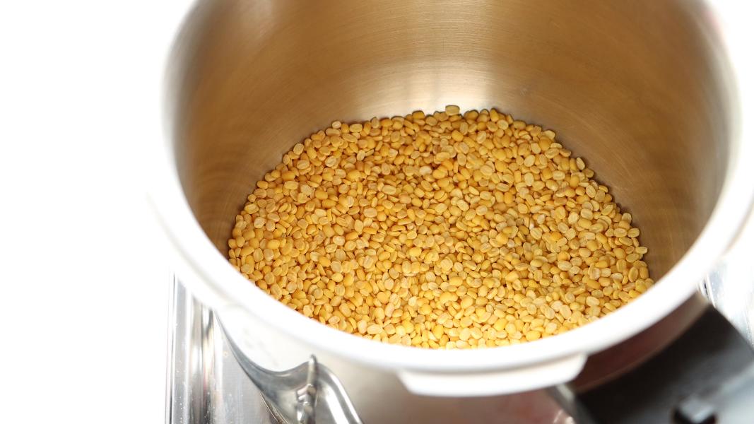 moong dal is roasting in a pressure cooker