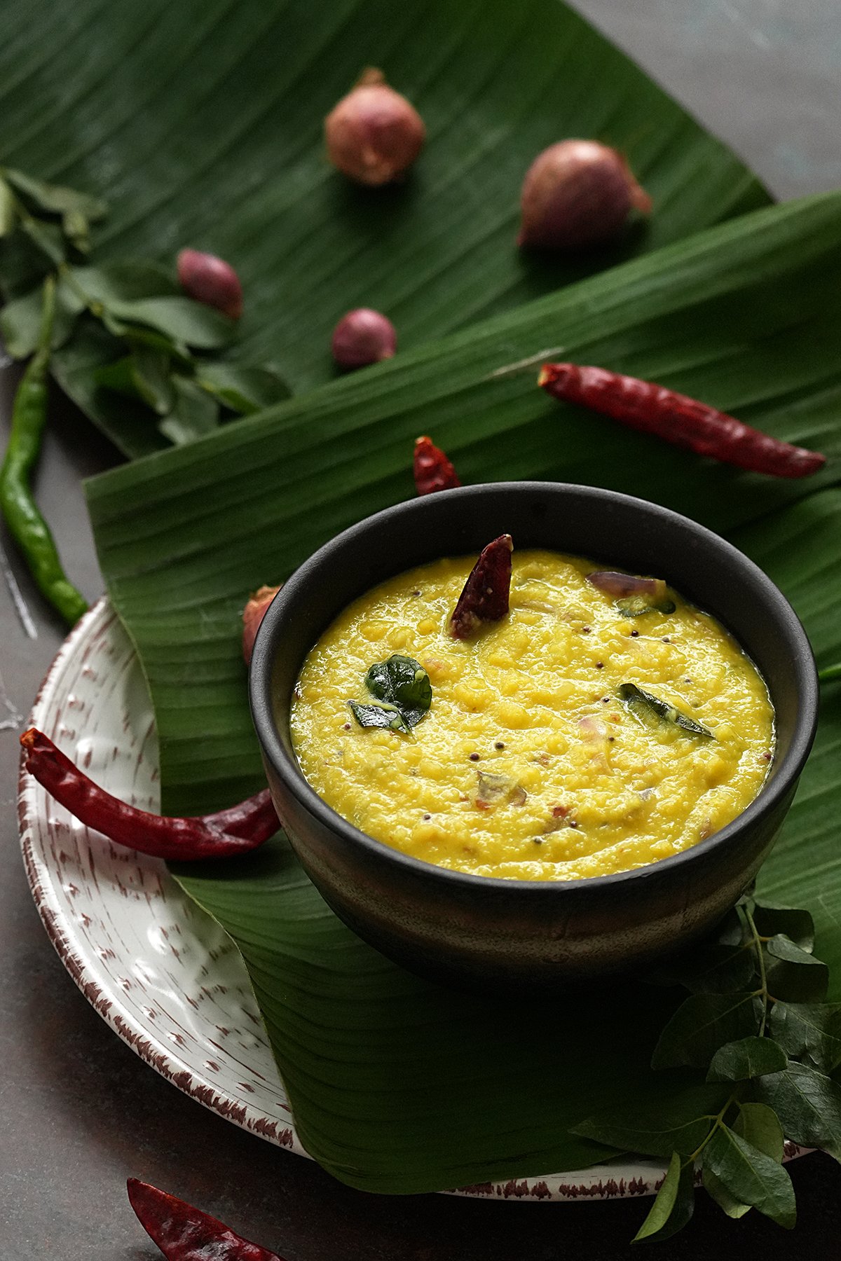 Sadya parippu curry in a bowl on a banana leaf