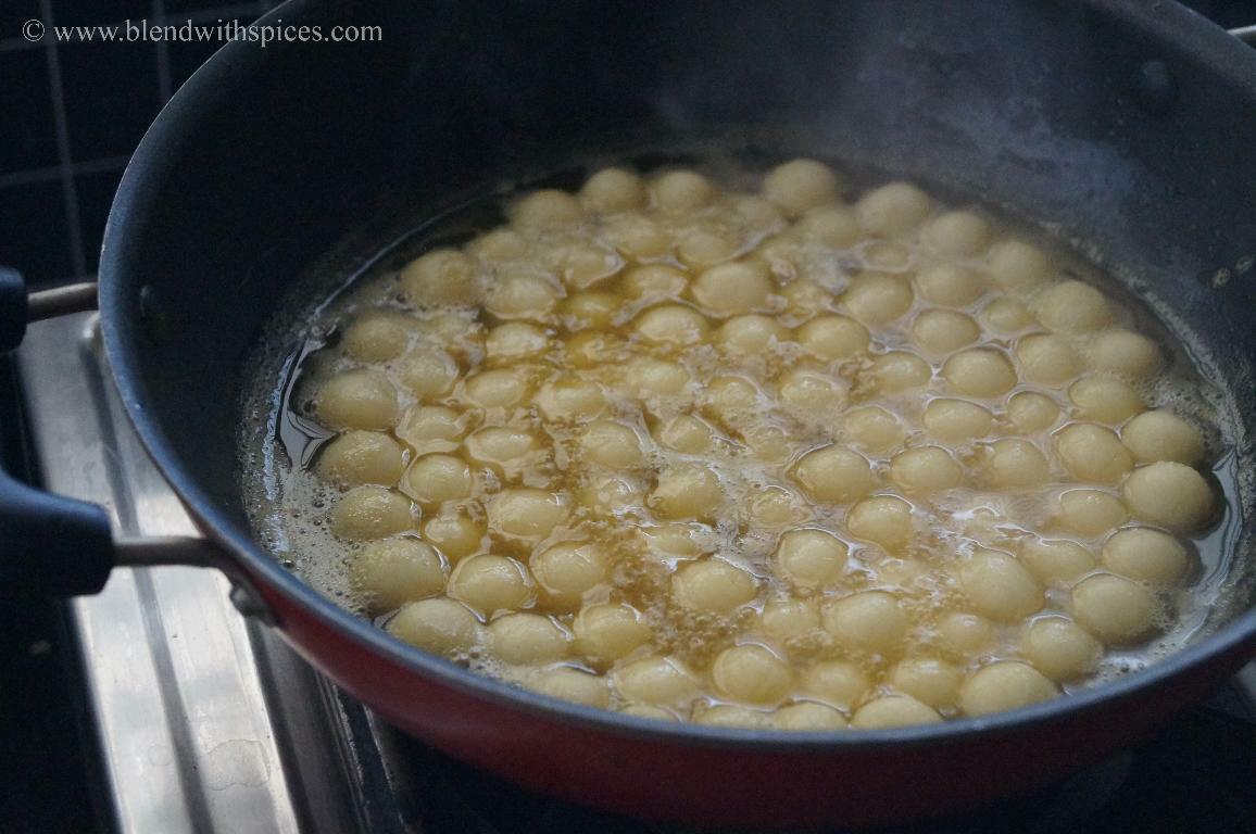 Rice flour dumplings simmered in jaggery syrup.