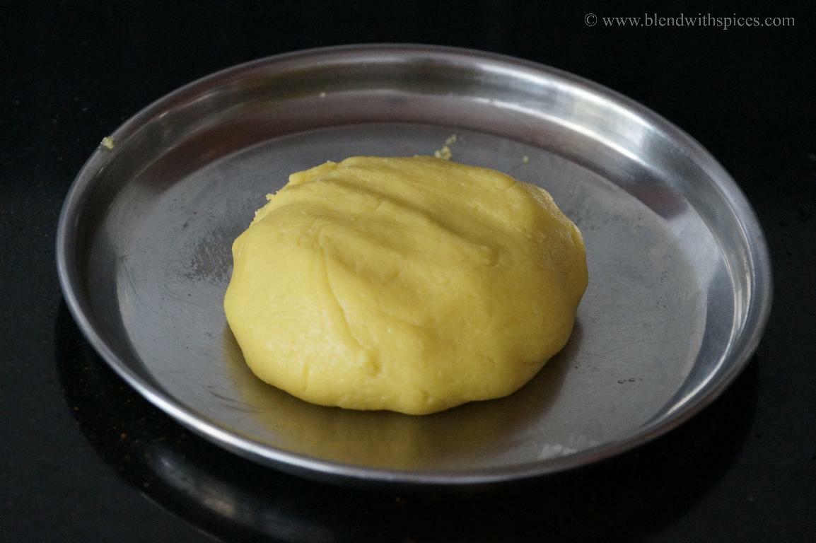 Cooked khoya/mawa mixture for kesar peda cooled down a bit and kneaded until smooth to shape.