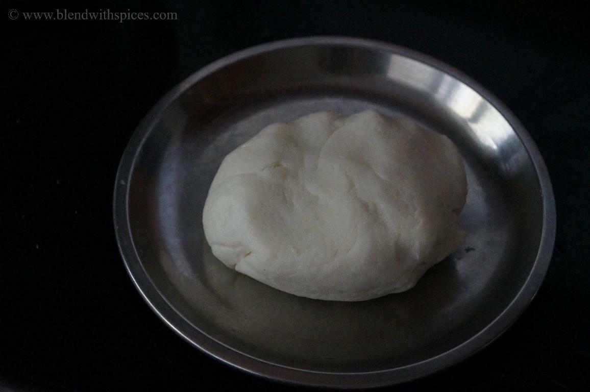 Cooked rice flour dough cooled slightly, kneaded and ready to shape for paal kozhukattai.