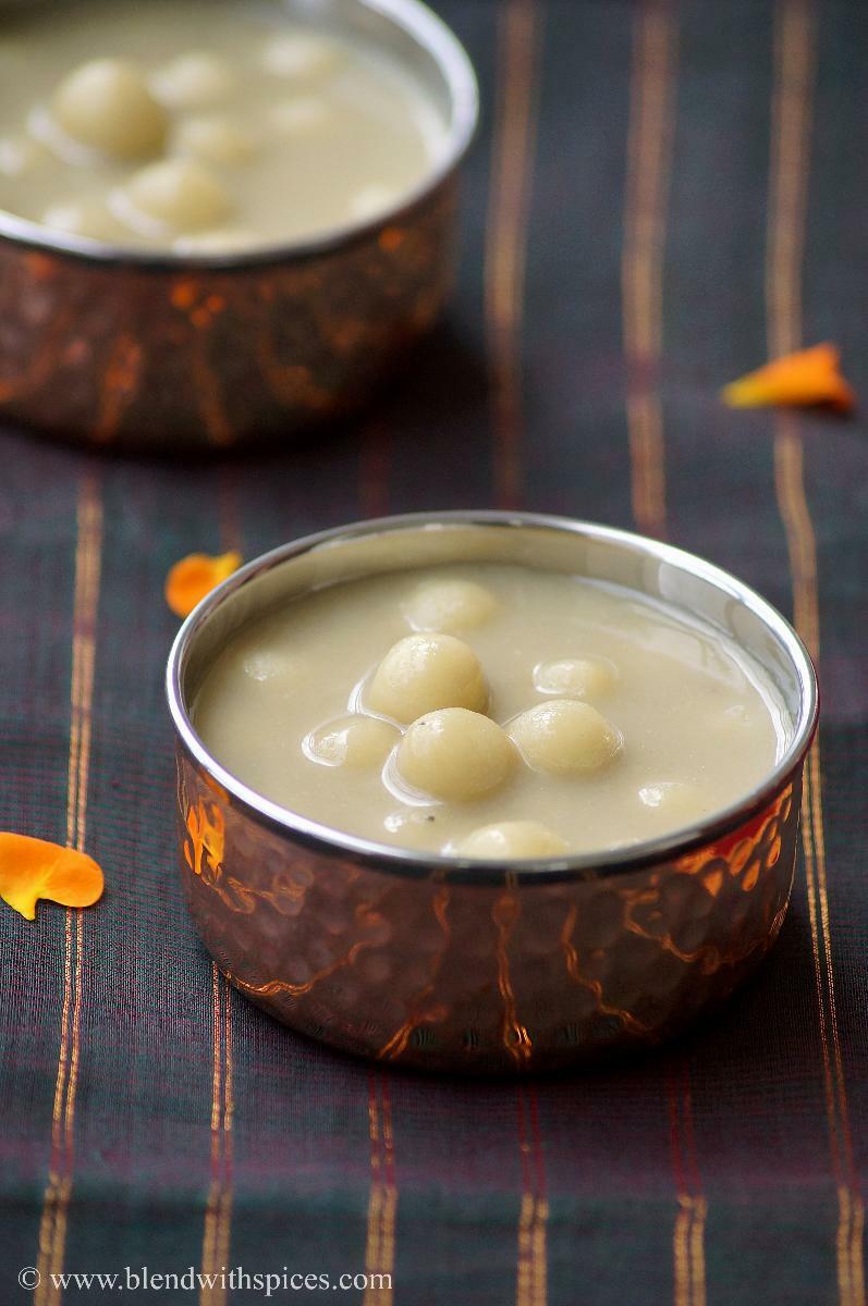 Paal kozhukattai, soft rice flour dumplings served in sweet coconut milk, in a traditional bowl.
