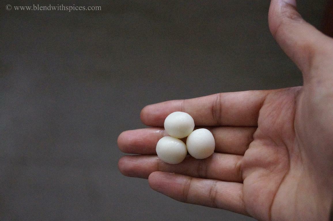 Rolling the rice flour dough into small balls for making traditional paal kolukattai.