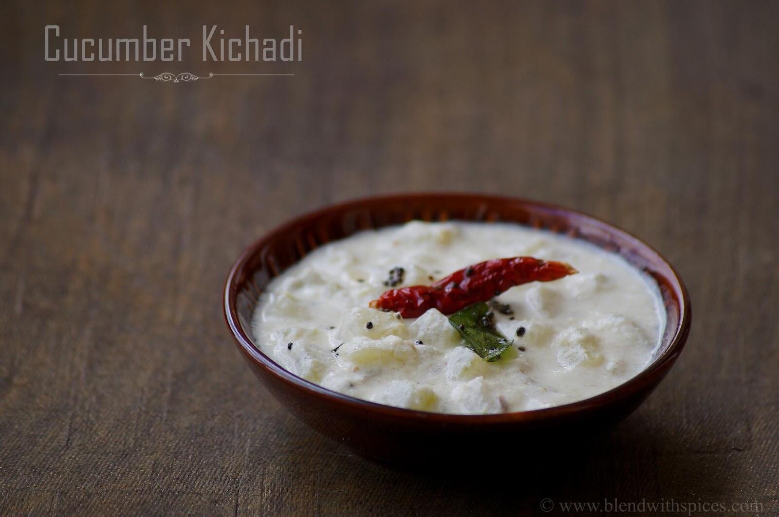 Traditional Kerala vellarikka kichadi or cucumber kichadi served in a small bowl, topped with tempered curry leaves, mustard leaves and red chili.