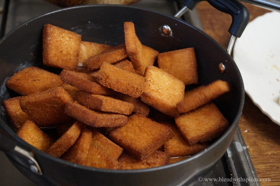 adding fried bread slices to the sugar syrup to make double ka meetha