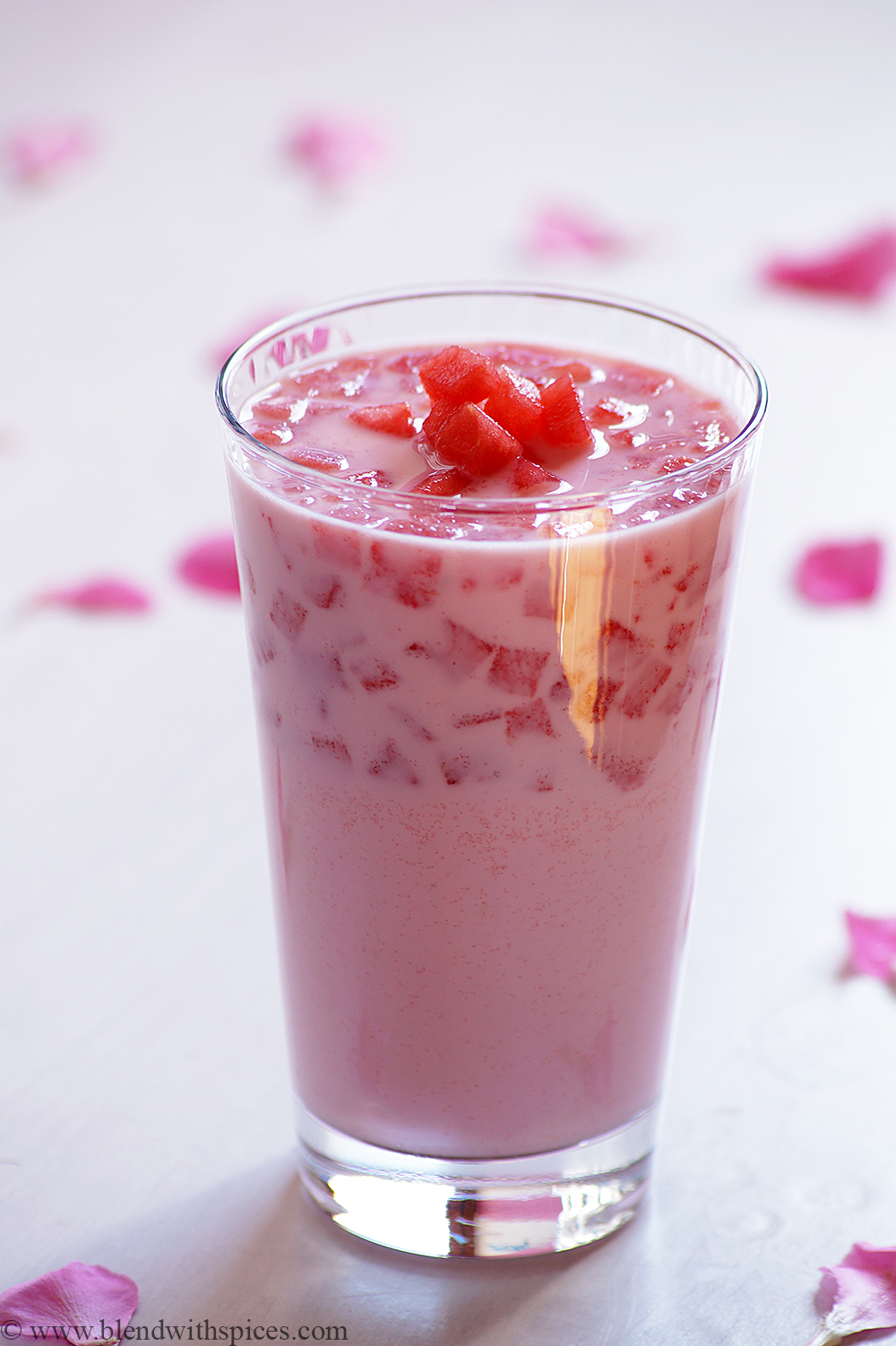 a glass of delhi mohabbat ka sharbat garnished with diced watermelon