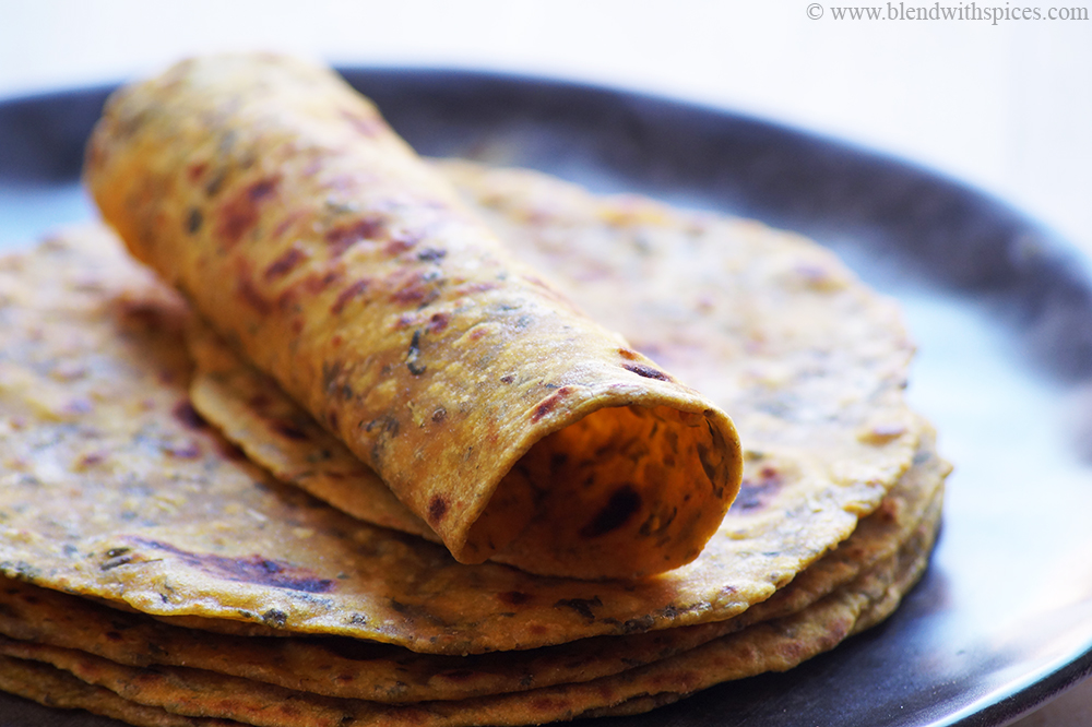 rolled dry methi parathas served on a plate