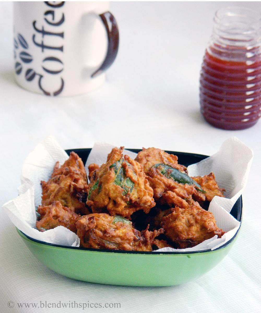crispy sweet potato pakoras or fritters served with tomato sauce and coffee