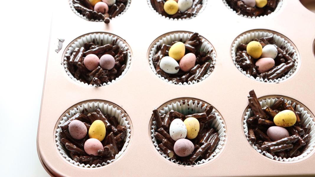 Mini chocolate eggs are placed on the top of each chocolate nest
