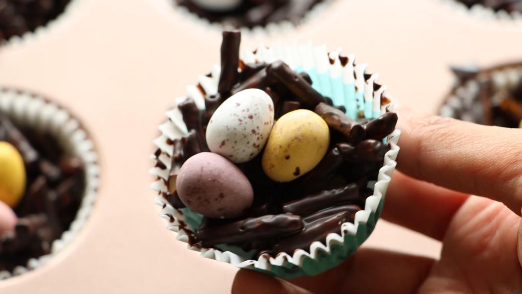 Pretzel chocolate nests with mini eggs are set in the refrigerator and ready to serve