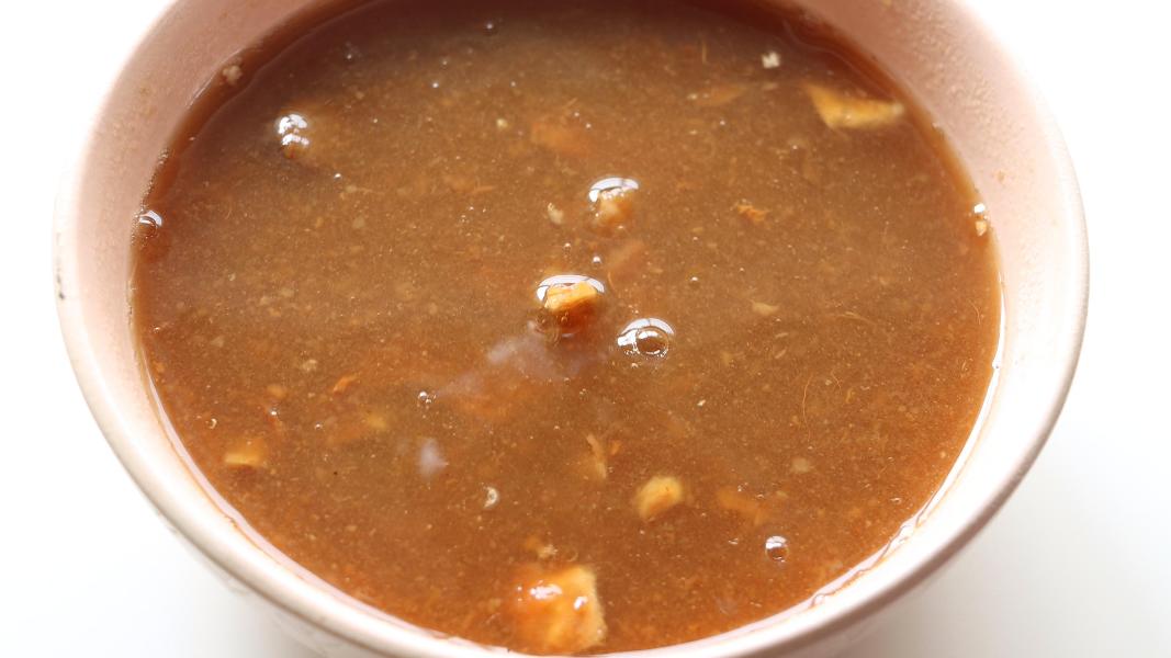 soaked and squeezed tamarind extract in a pink bowl 
