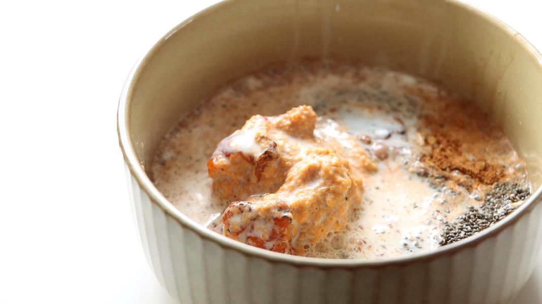 Milk is added to rolled oats, pumpkin puree, chia seeds, honey and pumpkin spice