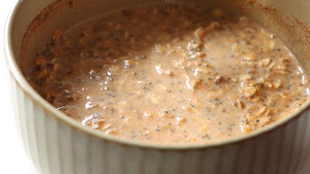 Pumpkin pie overnight oats mixture is combined in a bowl