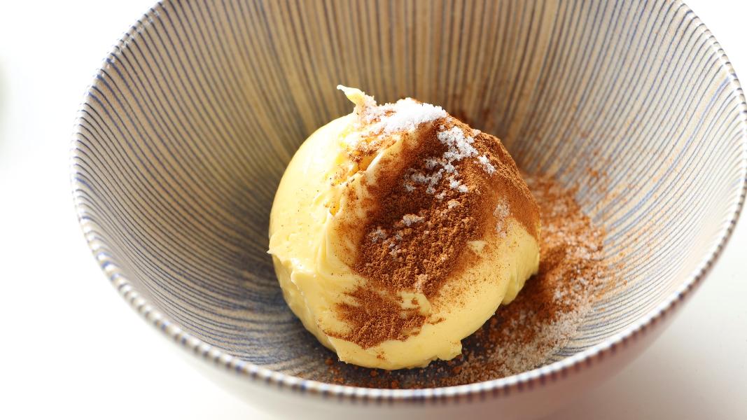 Unsalted butter, salt and pumpkin pie spice blend added to a small mixing bowl.