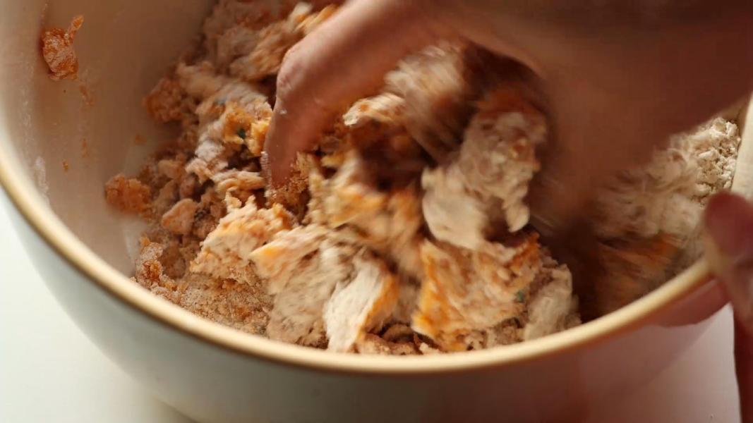 Kneading all the ingredients to make a dough.