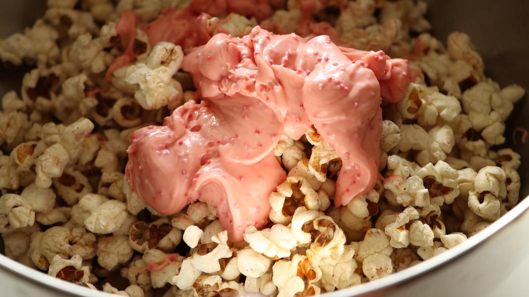 melted candy cane kisses poured over popcorn