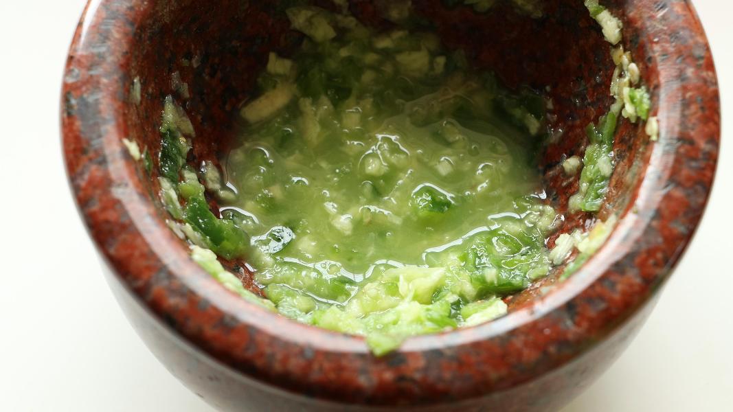 Freshly crushed garlic, jalapeno and lemon juice mixture for classic ful recipe.